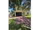 View of the back of the home with a screened-in porch and brick patio at 3660 Daydream Pl, St Cloud, FL 34772