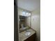 Bathroom with granite countertop, decorative mirror, and good lighting at 3660 Daydream Pl, St Cloud, FL 34772