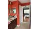 Bathroom with a vanity and sink with a view to the main bedroom at 3660 Daydream Pl, St Cloud, FL 34772