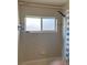 Standard white tub and shower combination with a frosted window at 3660 Daydream Pl, St Cloud, FL 34772