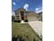Charming two-story home with a well-manicured lawn and a spacious three car garage at 3660 Daydream Pl, St Cloud, FL 34772