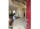 Inviting foyer featuring tile flooring that transitions into wood floors leading to the living area and a stairway at 3660 Daydream Pl, St Cloud, FL 34772