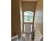 Bright foyer featuring a soaring ceiling, large window, and elegant chandelier at 3660 Daydream Pl, St Cloud, FL 34772