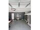 Spacious two car garage with ample room for storage, wall is painted gray at 3660 Daydream Pl, St Cloud, FL 34772