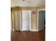 Hallway with wood floors, closet doors and views to other rooms at 3660 Daydream Pl, St Cloud, FL 34772