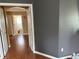 Hallway with wood floors, view to the bathroom at 3660 Daydream Pl, St Cloud, FL 34772