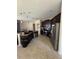 Spacious kitchen with dark cabinets, stainless steel appliances, granite countertops, and tile flooring at 3660 Daydream Pl, St Cloud, FL 34772