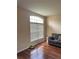 Features a large window providing natural light and hardwood flooring at 3660 Daydream Pl, St Cloud, FL 34772