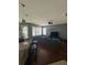 Open concept living room with wood floors, large windows, and modern decor at 3660 Daydream Pl, St Cloud, FL 34772