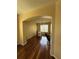 Bright office space featuring hardwood floors and an arched entryway for an open and inviting atmosphere at 3660 Daydream Pl, St Cloud, FL 34772