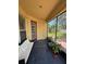 Cozy screened porch with outdoor seating, perfect for relaxing and enjoying the backyard views at 3660 Daydream Pl, St Cloud, FL 34772