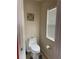 Cozy powder room with a toilet and a window that provides natural light at 3660 Daydream Pl, St Cloud, FL 34772