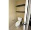 Small toilet room featuring a toilet and shelves at 3660 Daydream Pl, St Cloud, FL 34772