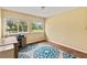 Bedroom featuring wood floors, a ceiling light, and a sunny window with a view of the yard at 428 Pelican Bay Dr, Daytona Beach, FL 32119