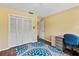 Bedroom featuring wood floors, a ceiling light, and a closet at 428 Pelican Bay Dr, Daytona Beach, FL 32119