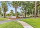 Welcome to Pelican Bay Country Club, showcasing a beautiful entrance sign and a well-kept landscape at 428 Pelican Bay Dr, Daytona Beach, FL 32119