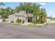 Well-maintained community clubhouse featuring an American flag, tidy landscaping, and plenty of charm at 428 Pelican Bay Dr, Daytona Beach, FL 32119