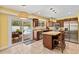 Updated kitchen with stainless steel appliances, granite countertops, and backyard pool access at 428 Pelican Bay Dr, Daytona Beach, FL 32119
