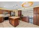 Modern kitchen with stainless steel appliances, granite countertops, and island with seating at 428 Pelican Bay Dr, Daytona Beach, FL 32119