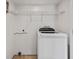 Laundry room features a newer model washer and wire shelving at 428 Pelican Bay Dr, Daytona Beach, FL 32119