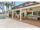 The covered patio features a full bar and outdoor seating at 428 Pelican Bay Dr, Daytona Beach, FL 32119