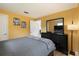Bedroom featuring neutral walls, a plush grey bed set, and black dresser with mirror at 999 16Th St, Edgewater, FL 32132