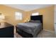 Bedroom featuring a padded headboard and windows dressed with white blinds allowing for natural light at 999 16Th St, Edgewater, FL 32132