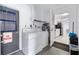Laundry room features a washer and dryer with easy access to the kitchen at 999 16Th St, Edgewater, FL 32132