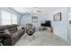 Comfortable living room featuring neutral tones, sleek flooring, and ample natural light at 999 16Th St, Edgewater, FL 32132