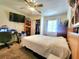 Bedroom with carpeted floors, ceiling fan and window with blinds at 1561 Copperfield Ave, Deltona, FL 32738