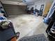 Spacious garage with door, tools and equipment at 1561 Copperfield Ave, Deltona, FL 32738