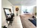 Open floor plan with dark wood accent table and decor in the entry hall at 1561 Copperfield Ave, Deltona, FL 32738