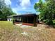 Exterior view of the screened-in patio, seamlessly blending indoor and outdoor living at 1561 Copperfield Ave, Deltona, FL 32738