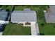 Overhead view displays home's roof, driveway, and landscaped yard, emphasizing its curb appeal at 1810 Western Rd, South Daytona, FL 32119