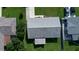 Aerial shot showcases a well-maintained roof and backyard, highlighting the property's overall condition at 1810 Western Rd, South Daytona, FL 32119