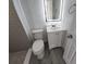 Stylish bathroom with a tiled walk-in shower, toilet, vanity, and LED illuminated mirror at 1810 Western Rd, South Daytona, FL 32119