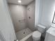 Updated bathroom with a tiled walk-in shower, modern fixtures, toilet, and vanity at 1810 Western Rd, South Daytona, FL 32119