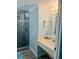Tidy bathroom with a glass enclosed shower and well-lit vanity at 1909 S Atlantic Ave # 405/406, Daytona Beach Shores, FL 32118