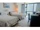 Sunlit bedroom offering two comfortable beds and large windows at 1909 S Atlantic Ave # 405/406, Daytona Beach Shores, FL 32118