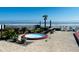 Relaxing hot tub with ocean views and lush landscaping at 1909 S Atlantic Ave # 405/406, Daytona Beach Shores, FL 32118