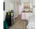 Cozy kitchenette with mini fridge, countertop, cabinets, and sleek flooring at 1909 S Atlantic Ave # 405/406, Daytona Beach Shores, FL 32118