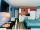 Inviting living space with TV, table and kitchenette for a cozy stay at 1909 S Atlantic Ave # 405/406, Daytona Beach Shores, FL 32118