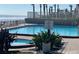 Refreshing pool with stunning ocean views and poolside lounging area at 1909 S Atlantic Ave # 405/406, Daytona Beach Shores, FL 32118