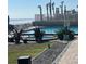 Inviting pool and hot tub area with ocean views and well-maintained landscaping at 1909 S Atlantic Ave # 405/406, Daytona Beach Shores, FL 32118