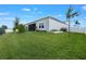 Expansive backyard with lush green grass, mature trees, and a privacy fence offering seclusion at 2137 Raglan Cir, Ormond Beach, FL 32174
