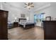 Comfortable bedroom features a tray ceiling, a ceiling fan, and natural light at 2137 Raglan Cir, Ormond Beach, FL 32174