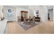 Cozy dining room featuring a round table, wood-look tile flooring, and ample natural light at 2137 Raglan Cir, Ormond Beach, FL 32174
