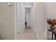 Clean hallway featuring neutral walls, tile flooring and white doors leading to different rooms at 2137 Raglan Cir, Ormond Beach, FL 32174