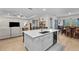 Bright, open-concept kitchen with a large island, stainless appliances, and a seamless flow to the living area at 2137 Raglan Cir, Ormond Beach, FL 32174