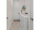 Convenient laundry room with a washer, dryer, and storage shelves at 2137 Raglan Cir, Ormond Beach, FL 32174